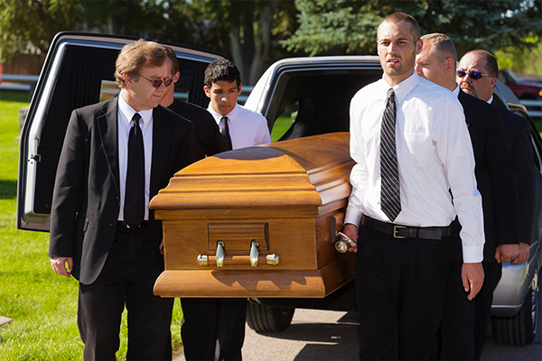 men-carrying-casket