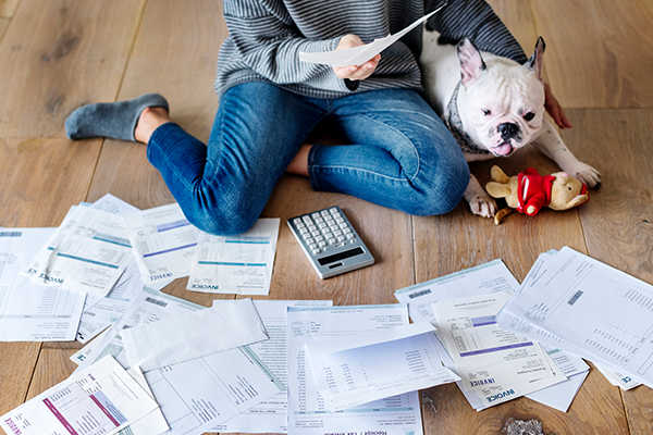 woman-surrounded-by-bills