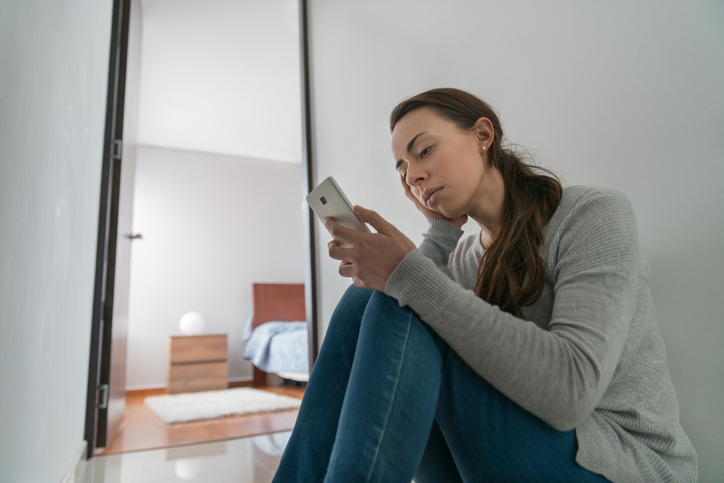 woman looking at phone