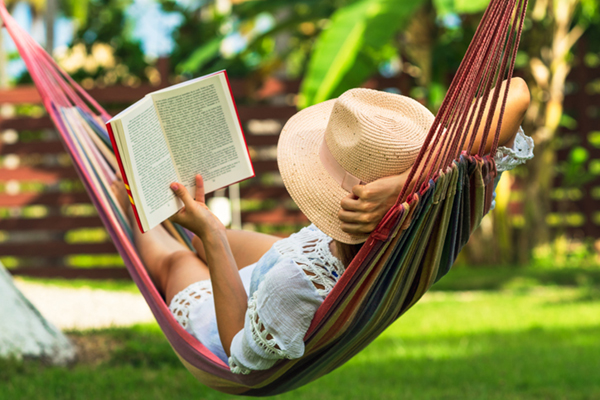 woman reading in hammock