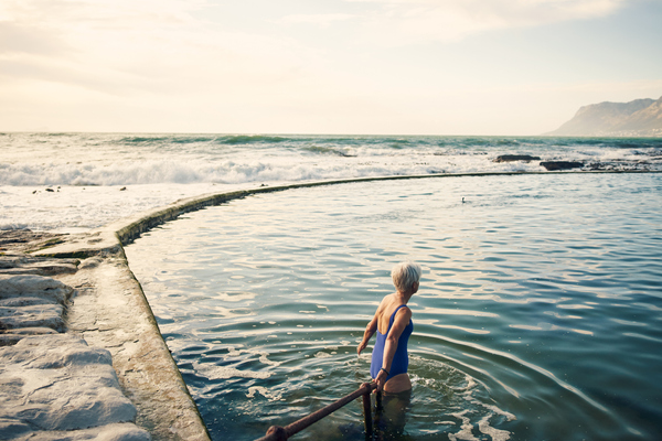 woman going into pool