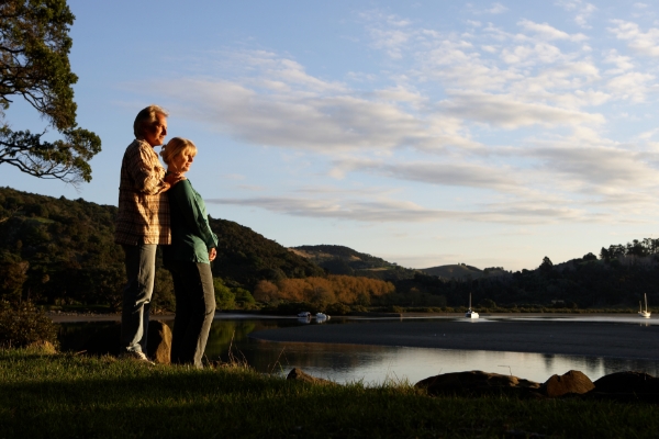 couple standing by lake