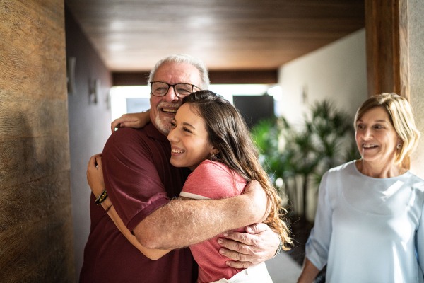 young-woman-hugging-grandfather